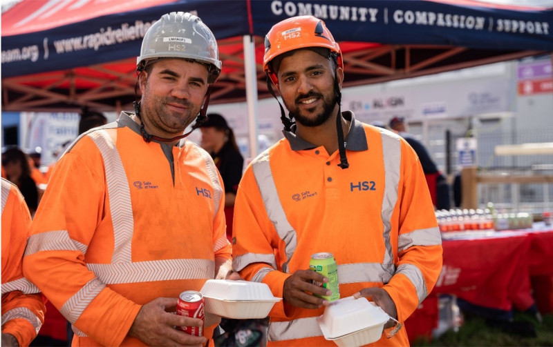 Two workers from HS2 project enjoying refreshment from charity van from RRT sponsored by RVT Group