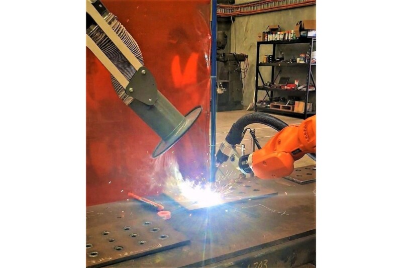 Close-up-of-welding-in-action-and-RAVEX-Mobile-Welding-Fume-Station-arm-extracting-fumes-to-the-left