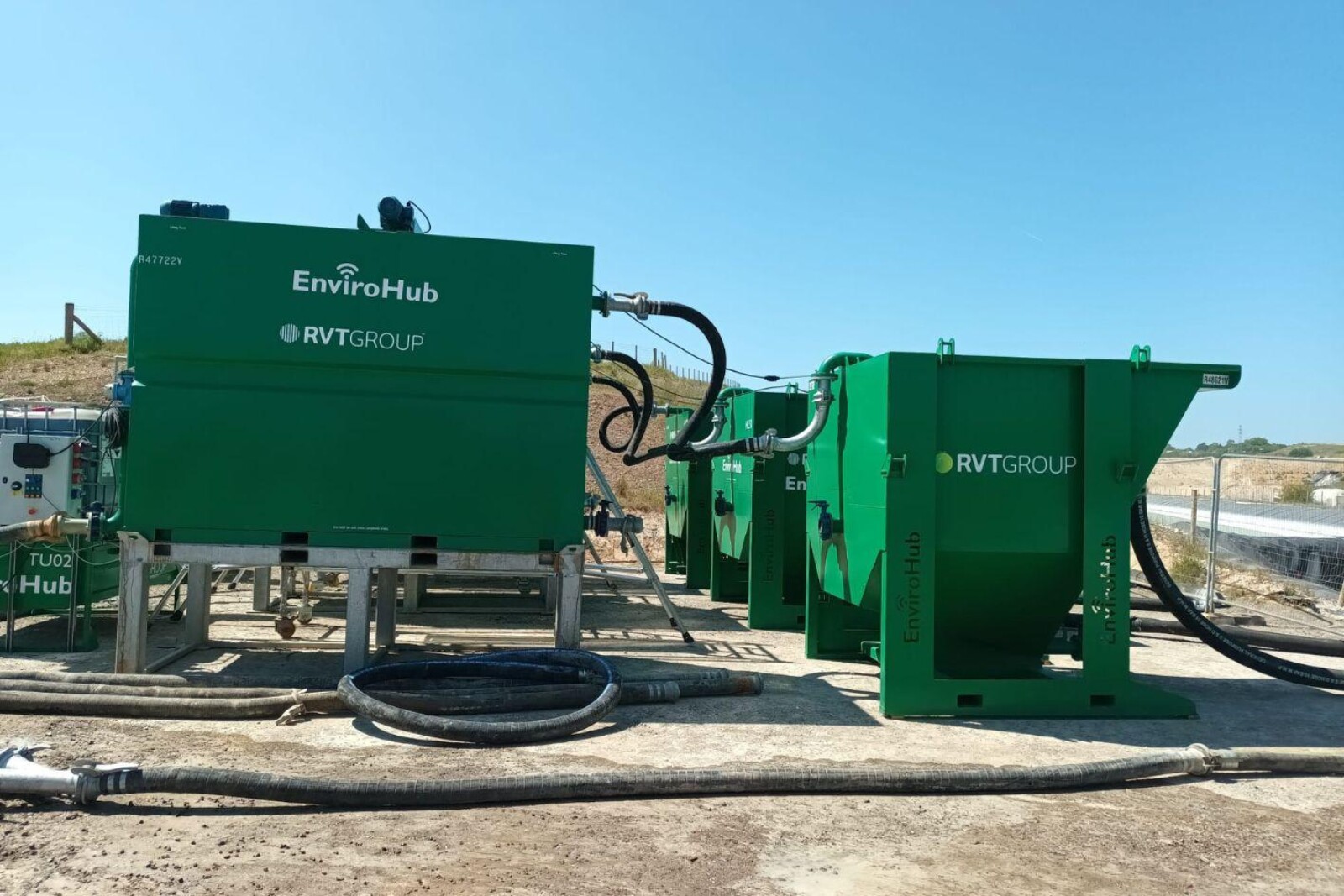 EnviroHub TT10 Treatment Tank on the left connected by a pipe to a settlement tank on the right