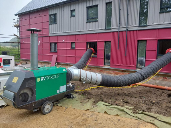 CLIMEX®-indirect-oil-fired-site-heater-with-ducting-going-into-a-building-with-ducting-split-off-into-multiple-ducting-points