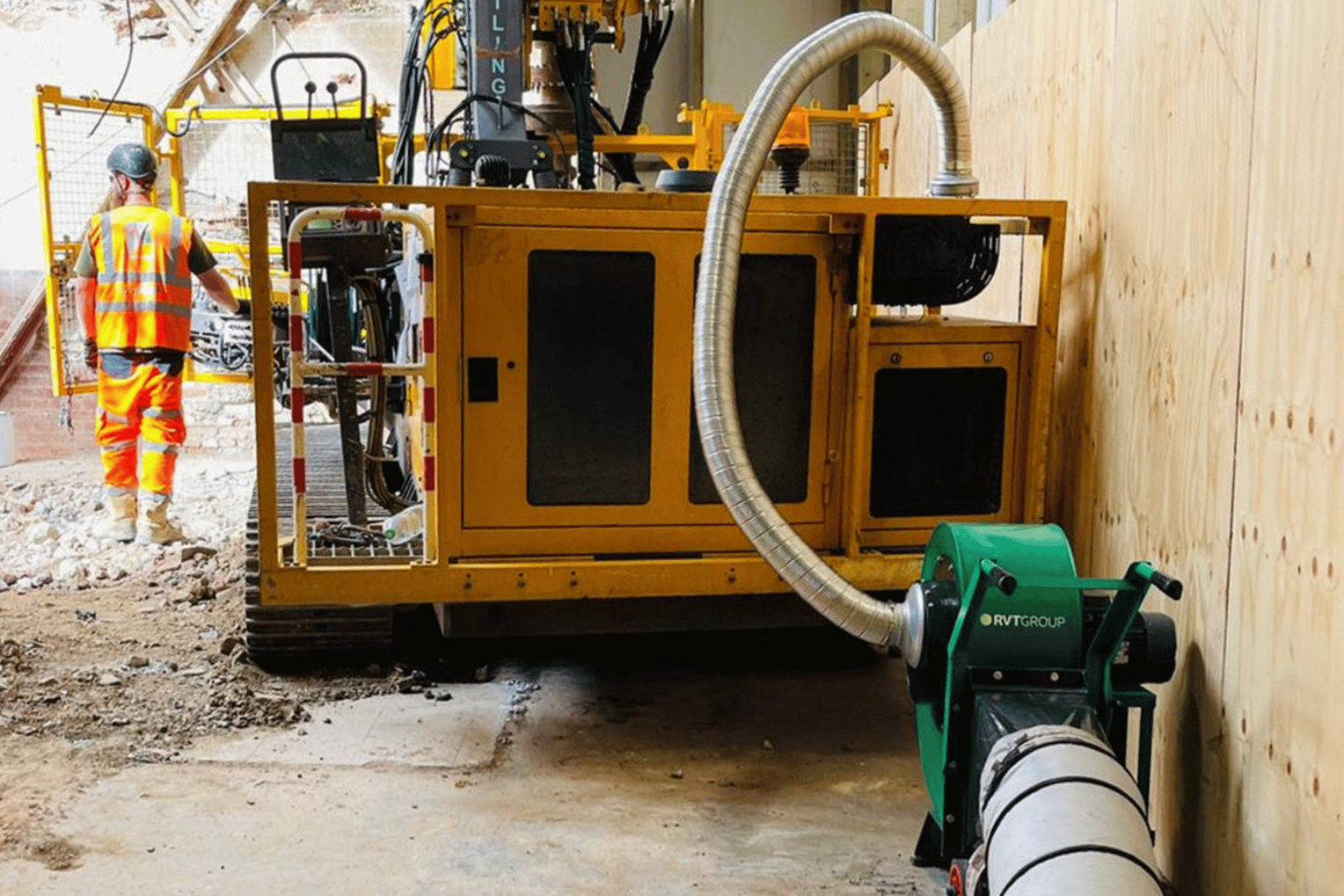 Ravex Exhaust Extraction Kit and flexible hosing coming from the exhaust of a large piling rig