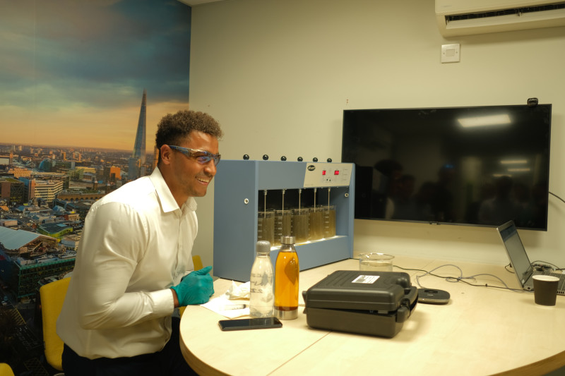 Water specialist Daniel from RVT Group performing a jar test experiment