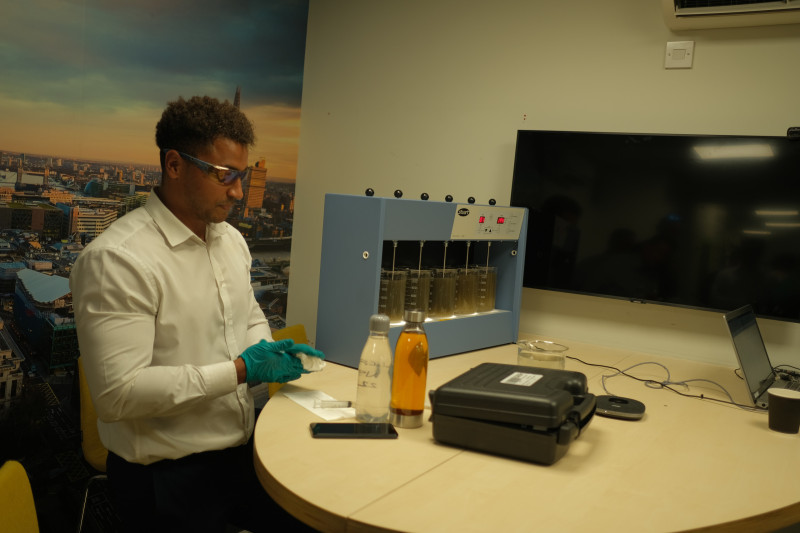 Water specialist Daniel from RVT Group performing a jar test experiment
