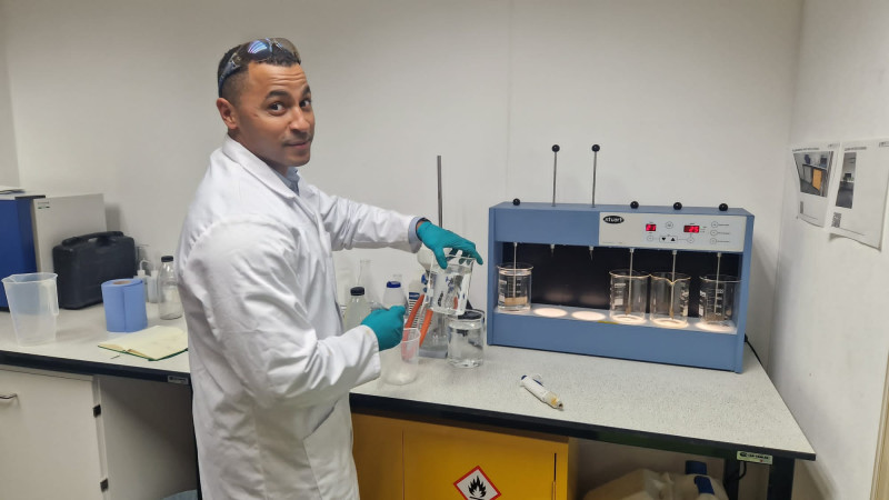 Water specialist Daniel from RVT Group performing a jar test experiment