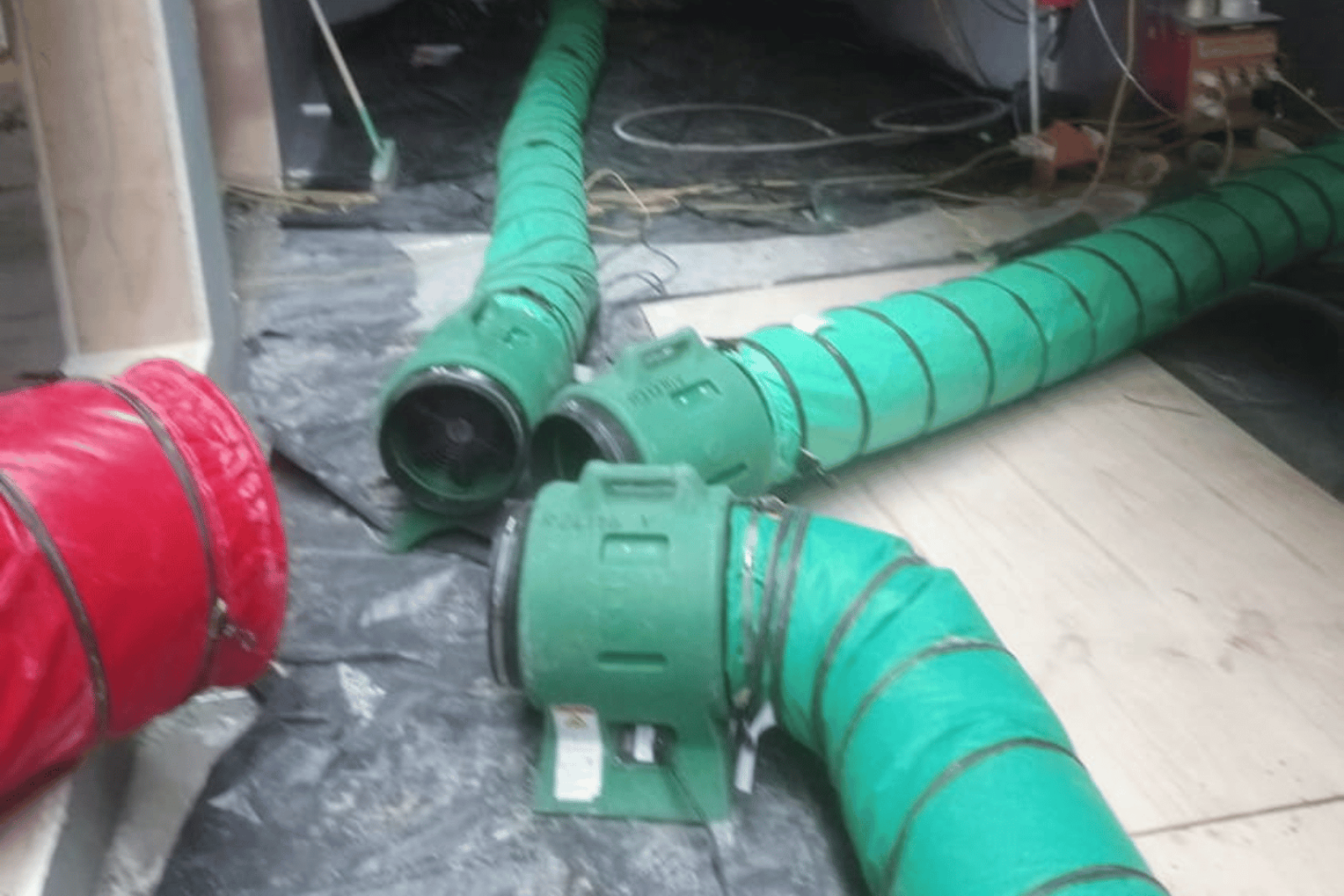 Three Climex Air Distribution Kit 300 receiving warm air from a heater and circulating it to different rooms in a building shell via ducting