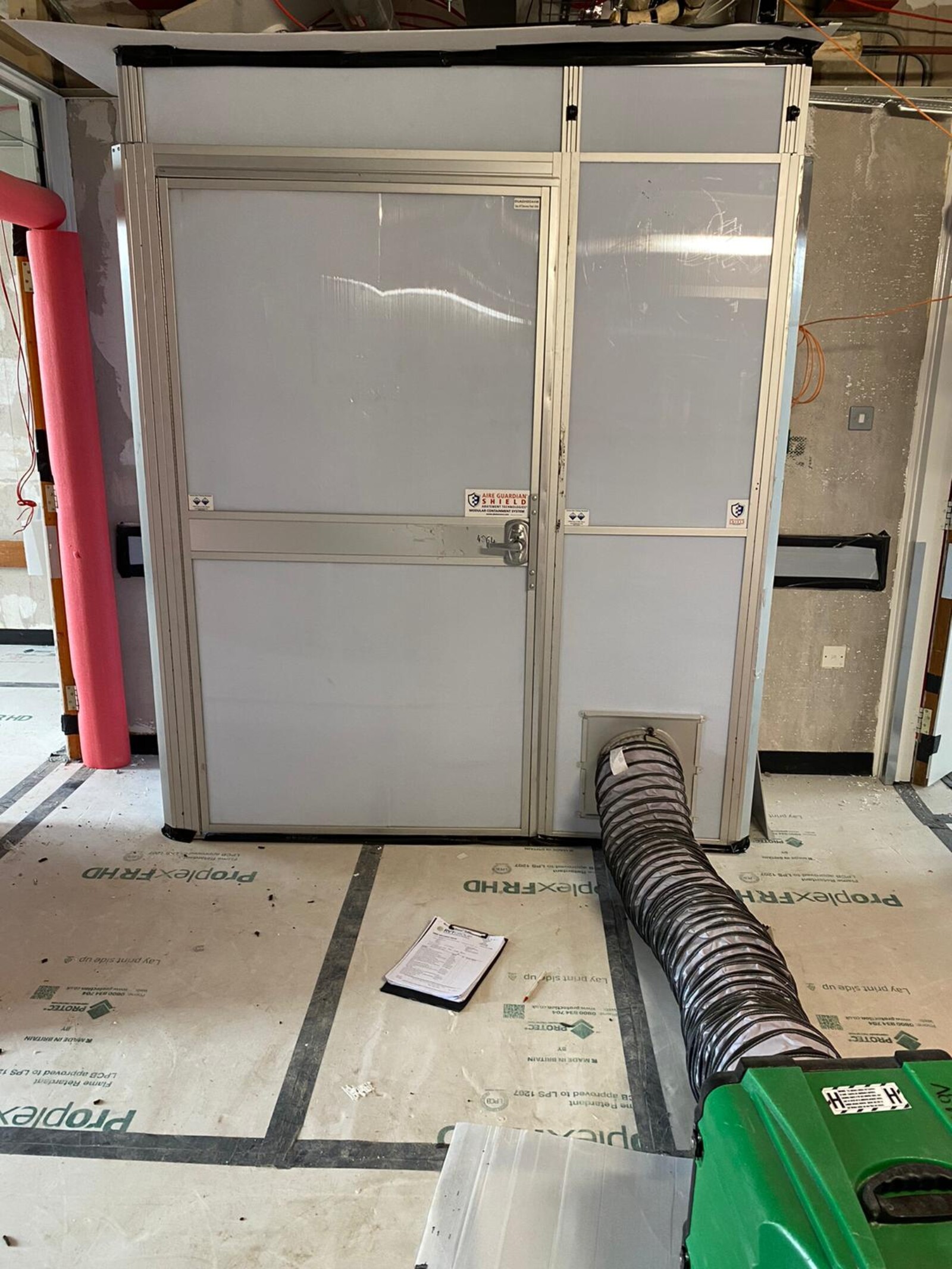 Dustex Aire Guardian enclosure and Raptor dust extraction unit creating negative pressure conditions on a live project
