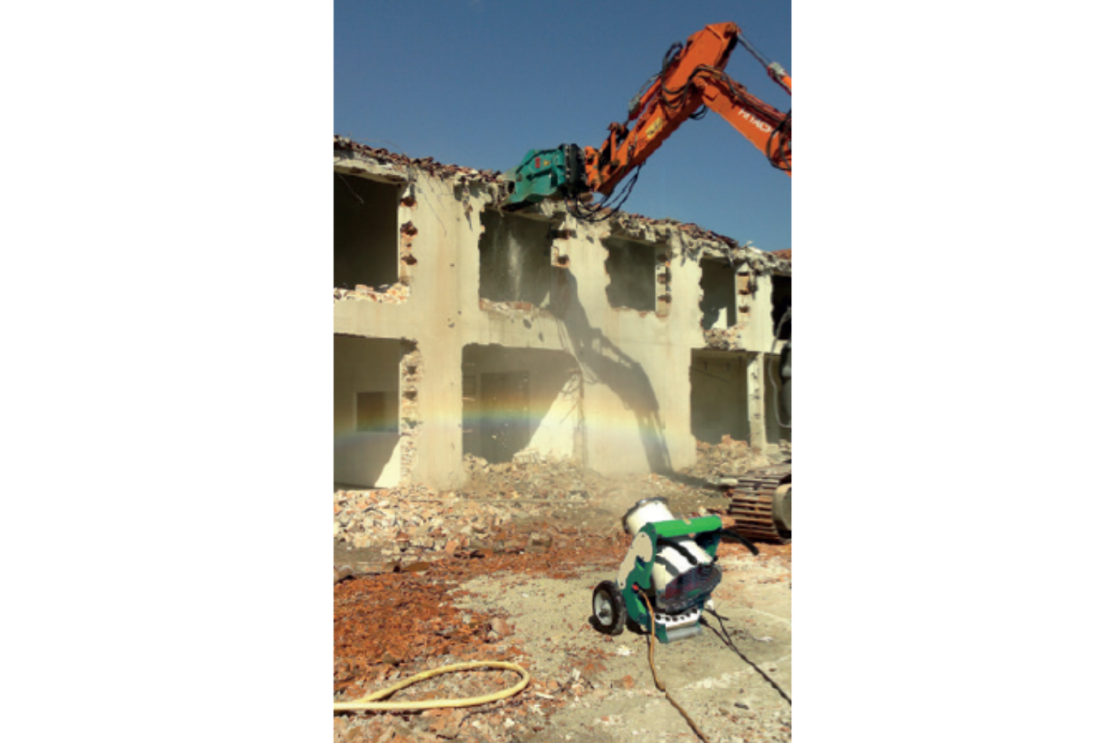 Dustex Hydramist 13 dust suppression unit in action during building structure demolition
