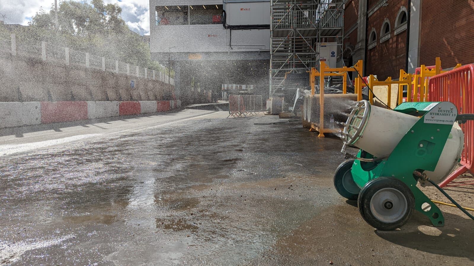 Dustex Hydramist 13 dust suppression unit spraying water on a dusty road