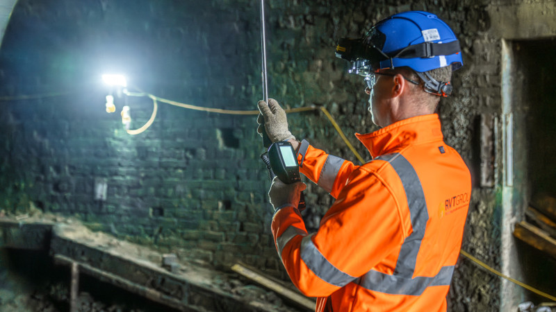 Vince Crane on site measuring gas levels inside a railway tunnel