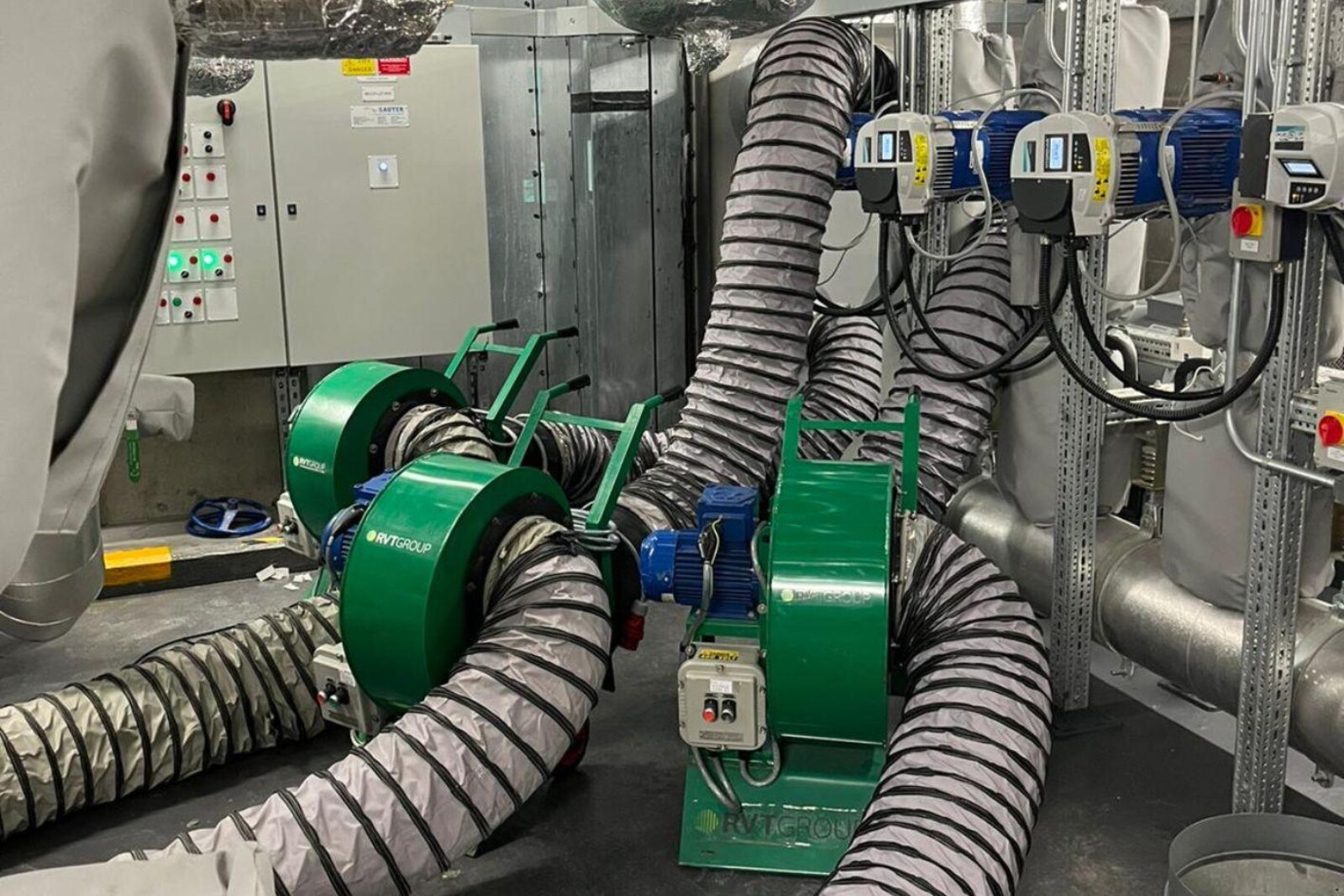 3 VENTEX Centrifugal Fan 300M providing ventilation in an industrial environment with pipework to the right of the fans