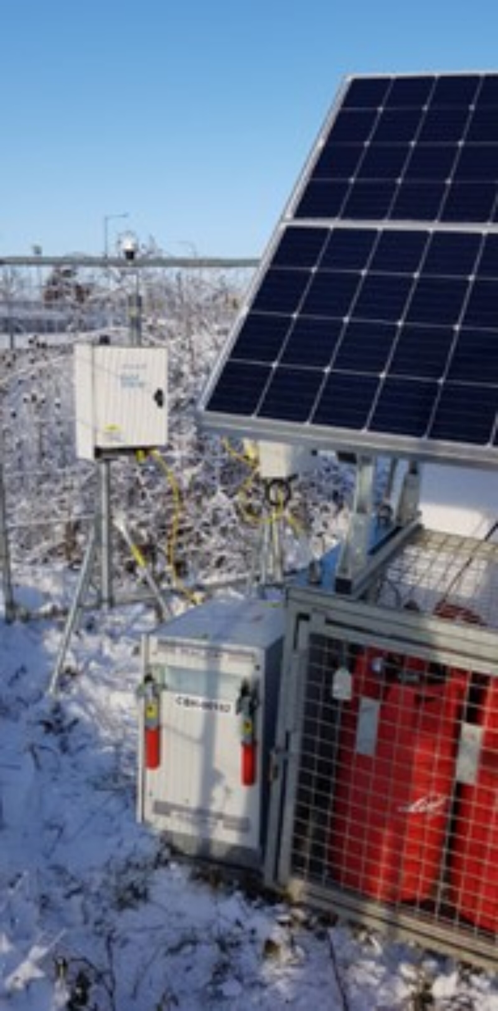 Eco-CH2 Cabinet and Cage powering dust monitors in the snow