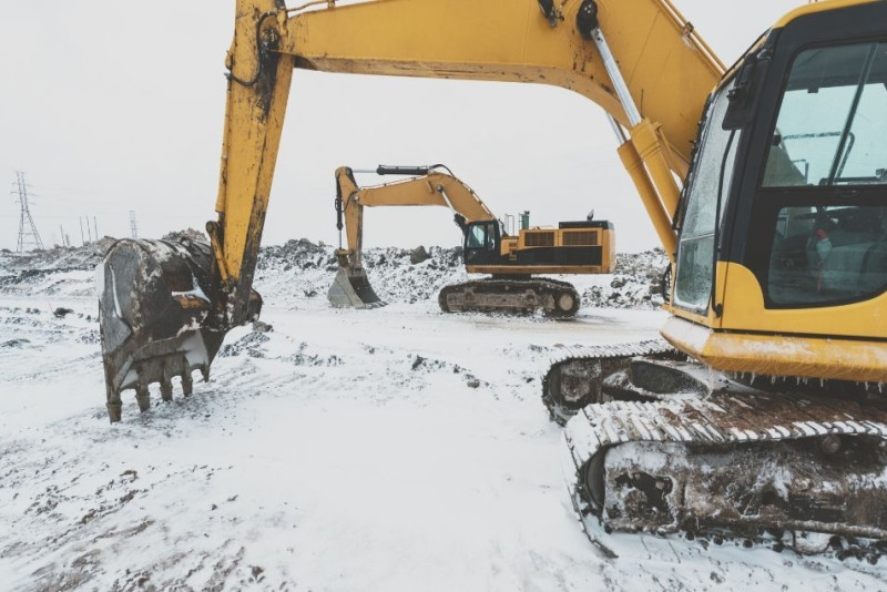 Excavators in the snow