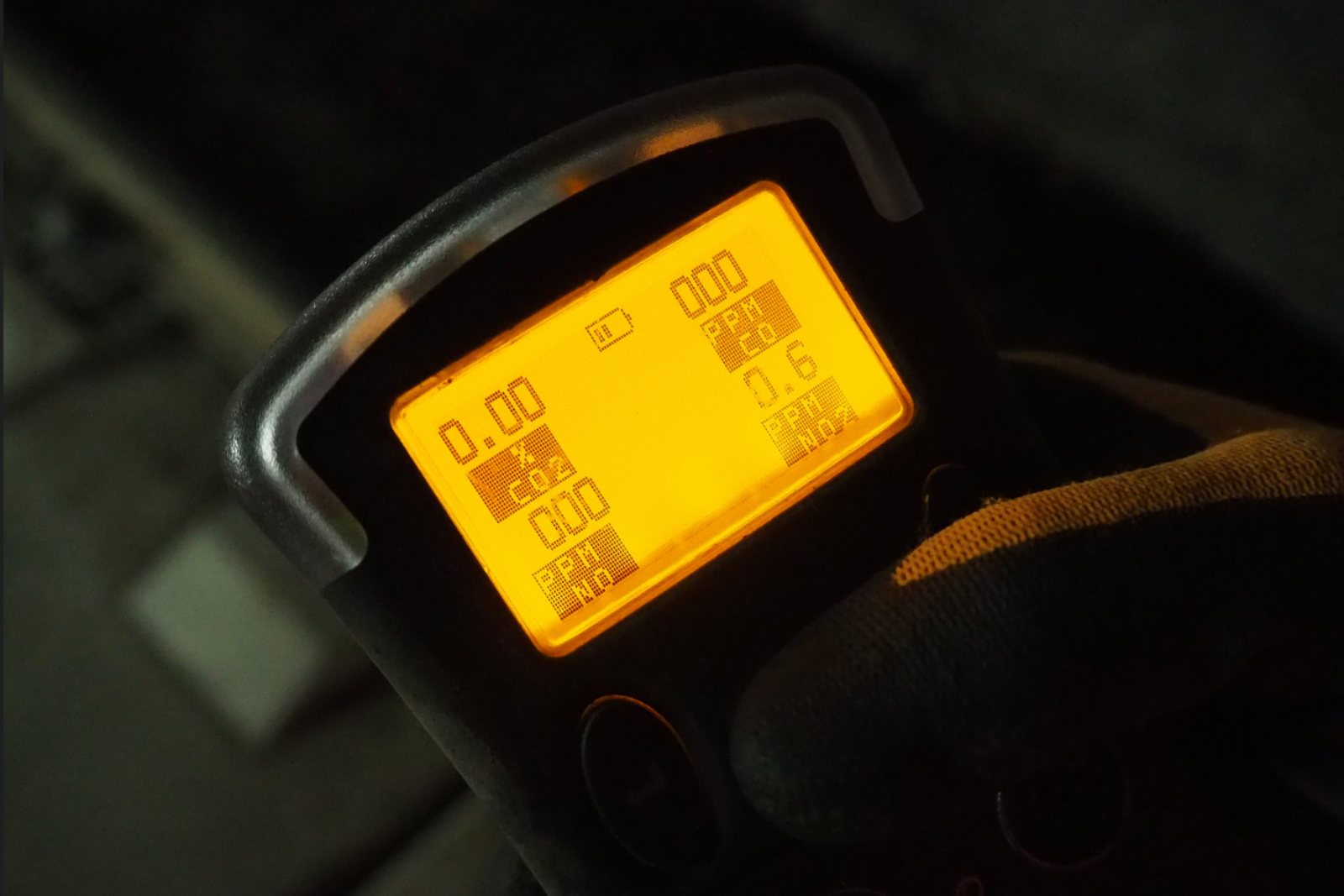 MONITEX P55 Hand-Held Gas Monitor close up of screen in a gloved hand