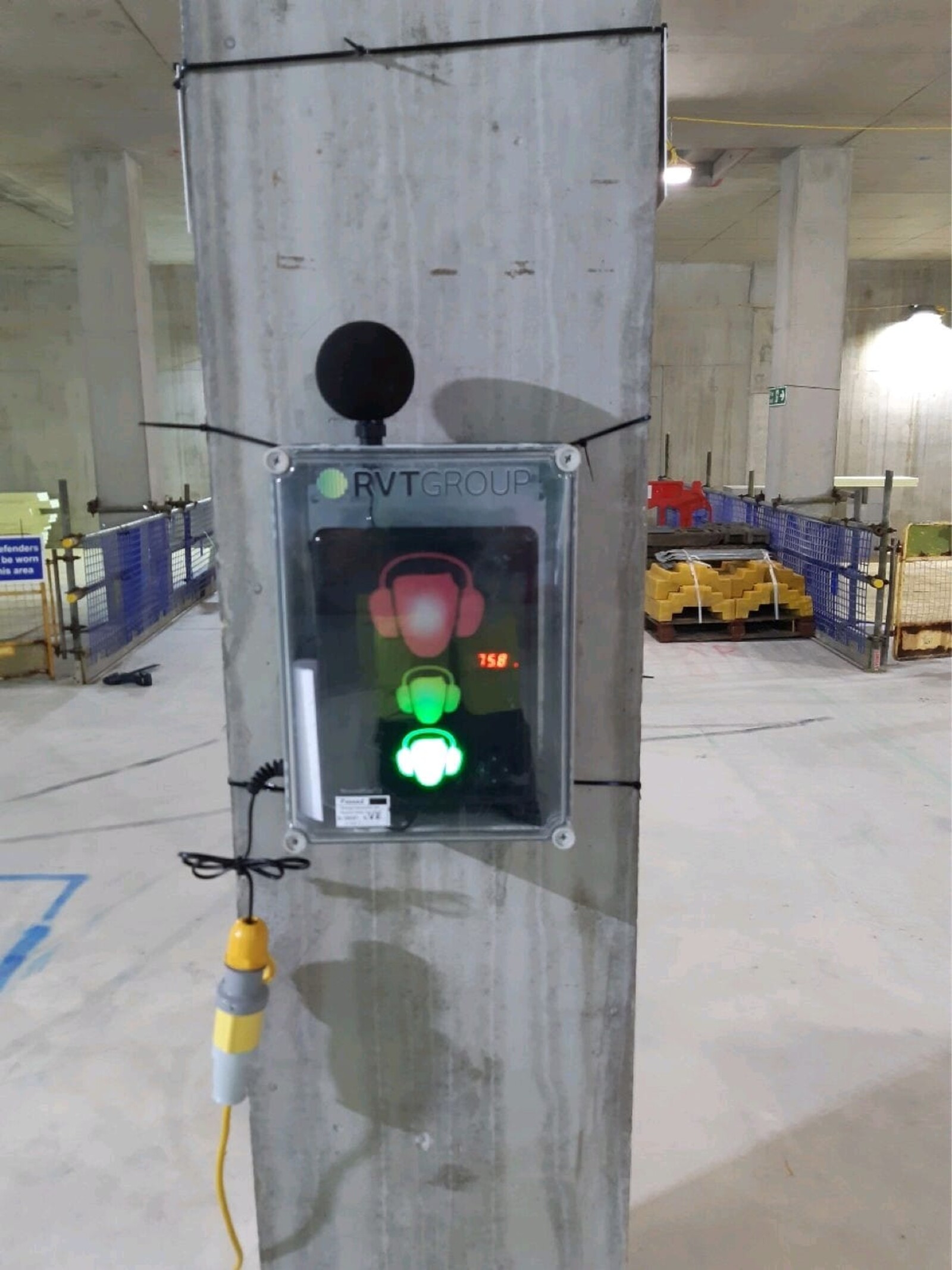 Portable Noise Level Warning System mounted to a wall whilst internal construction works take place