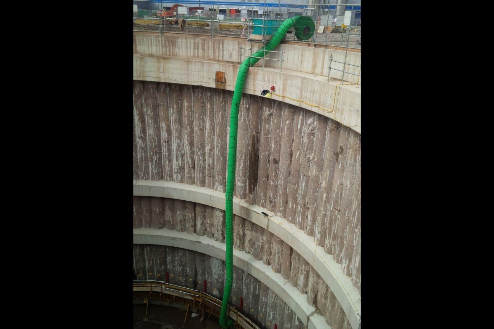 VENTEX Centrifugal Fan 450S on the edge of a shaft with ducting stretching the length of the shaft providing ventilation to works taking place at the bottom