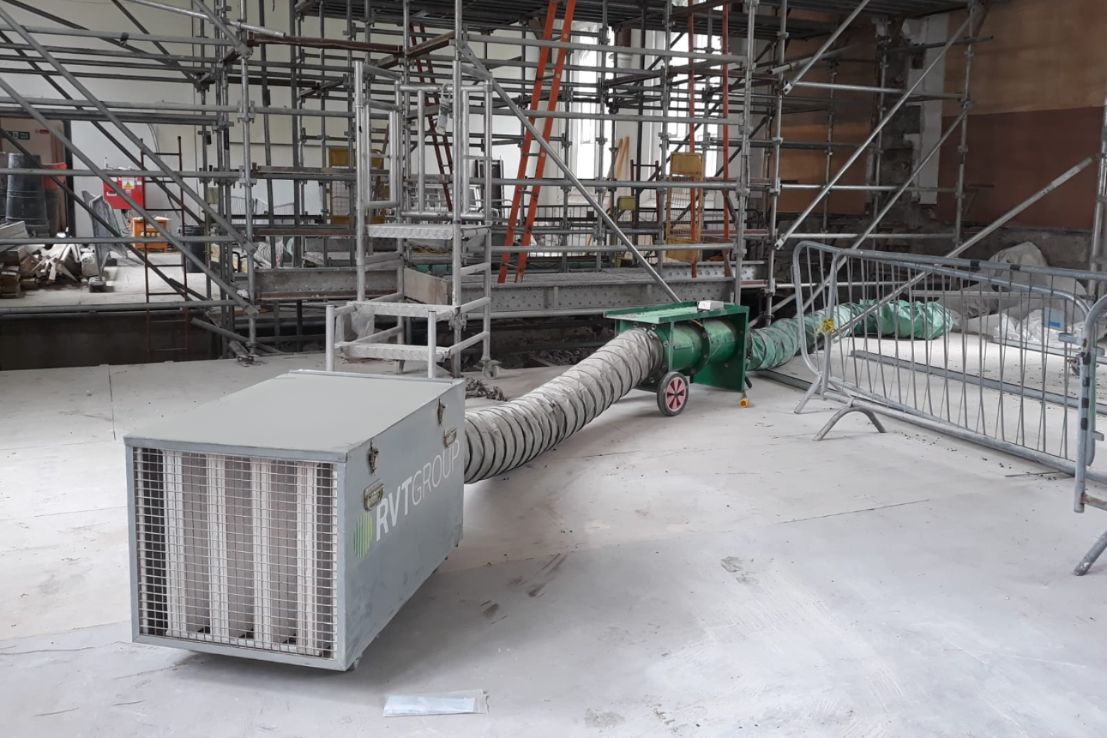 VENTEX Twin Axial Fan 300M and dust extraction unit helping remove dust from works taking place on the scaffolding next to the units