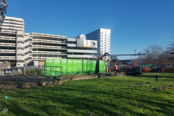 Acoustic curtains surrounding a demolition project