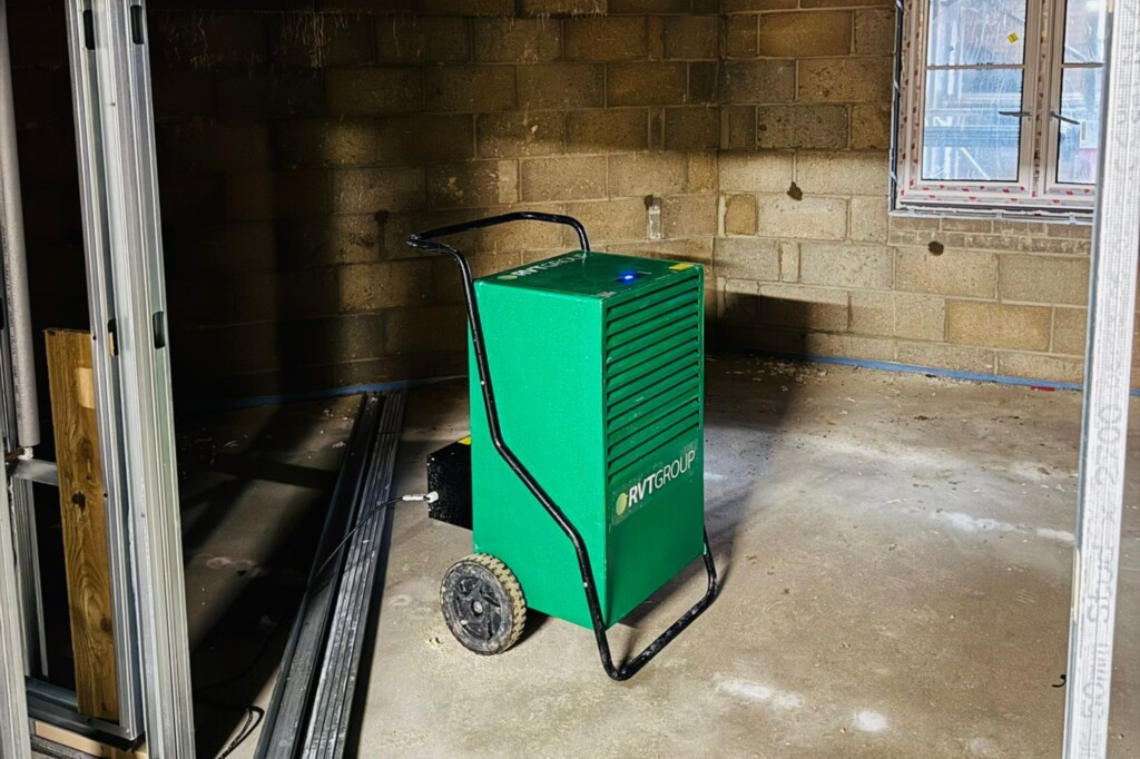 Dehumidifier drying out a damp room undergoing refurbishment