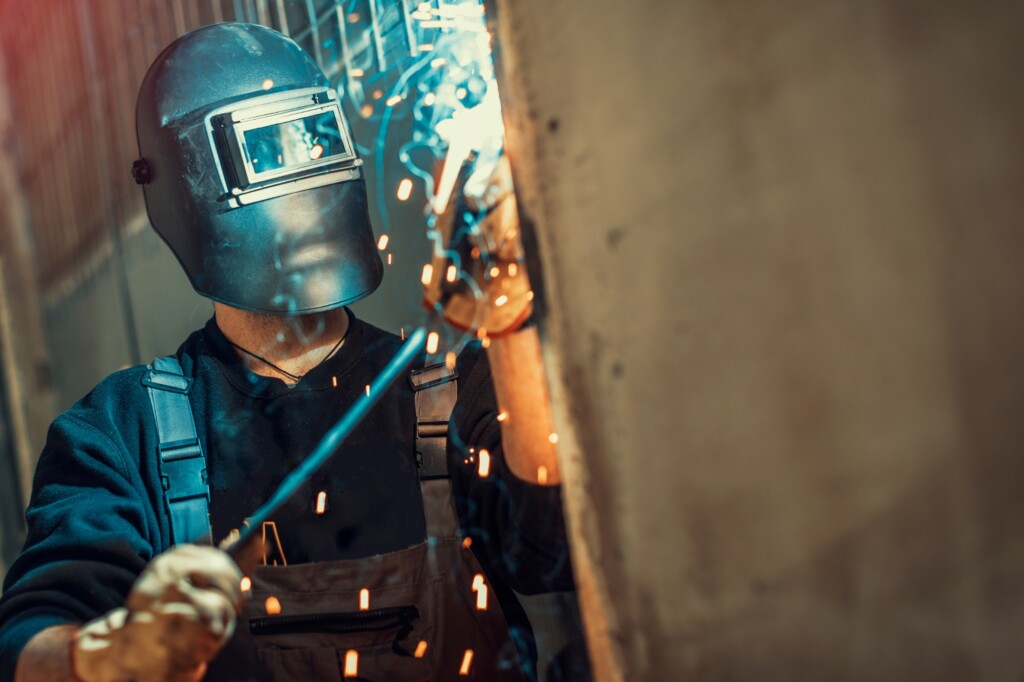 welding in operation with visible fumes