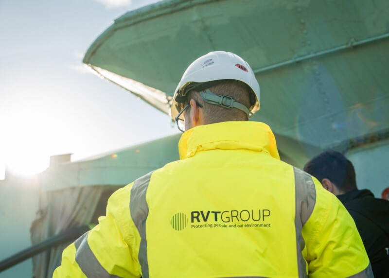 hire vs purchase. Man in RVT Group PPE looking out to a ship