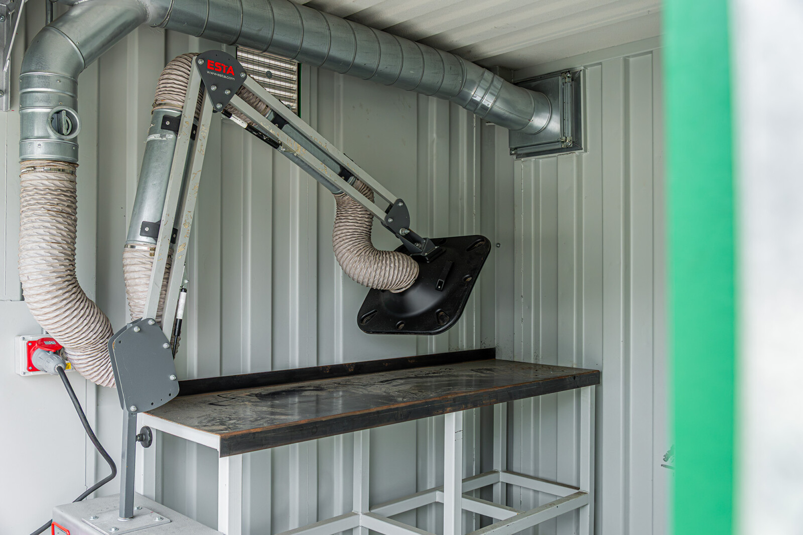 Interior: RAVEX® Welding Control Container – workbench and extraction arm
