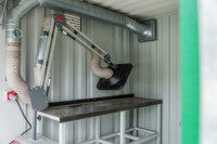 Interior: RAVEX® Welding Control Container – workbench and extraction arm